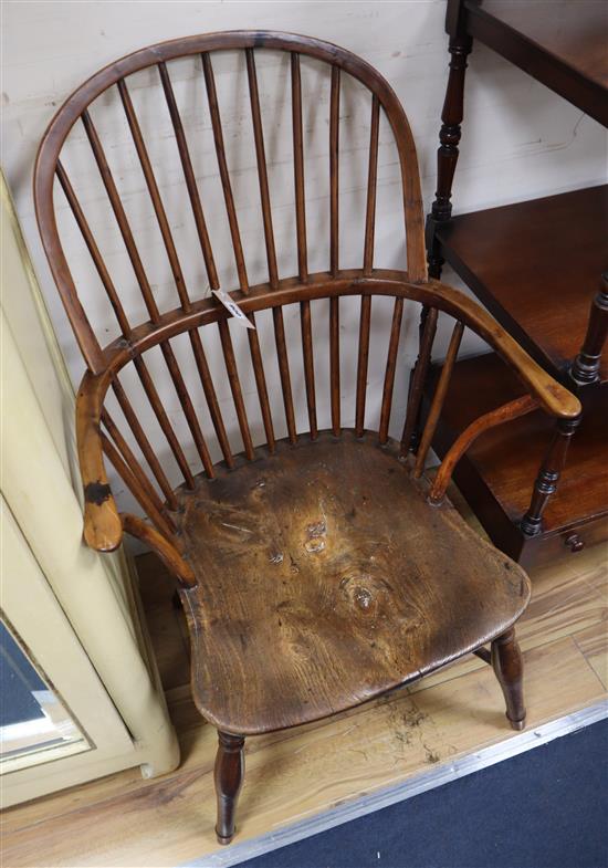 A Victorian yew and elm comb back Windsor armchair